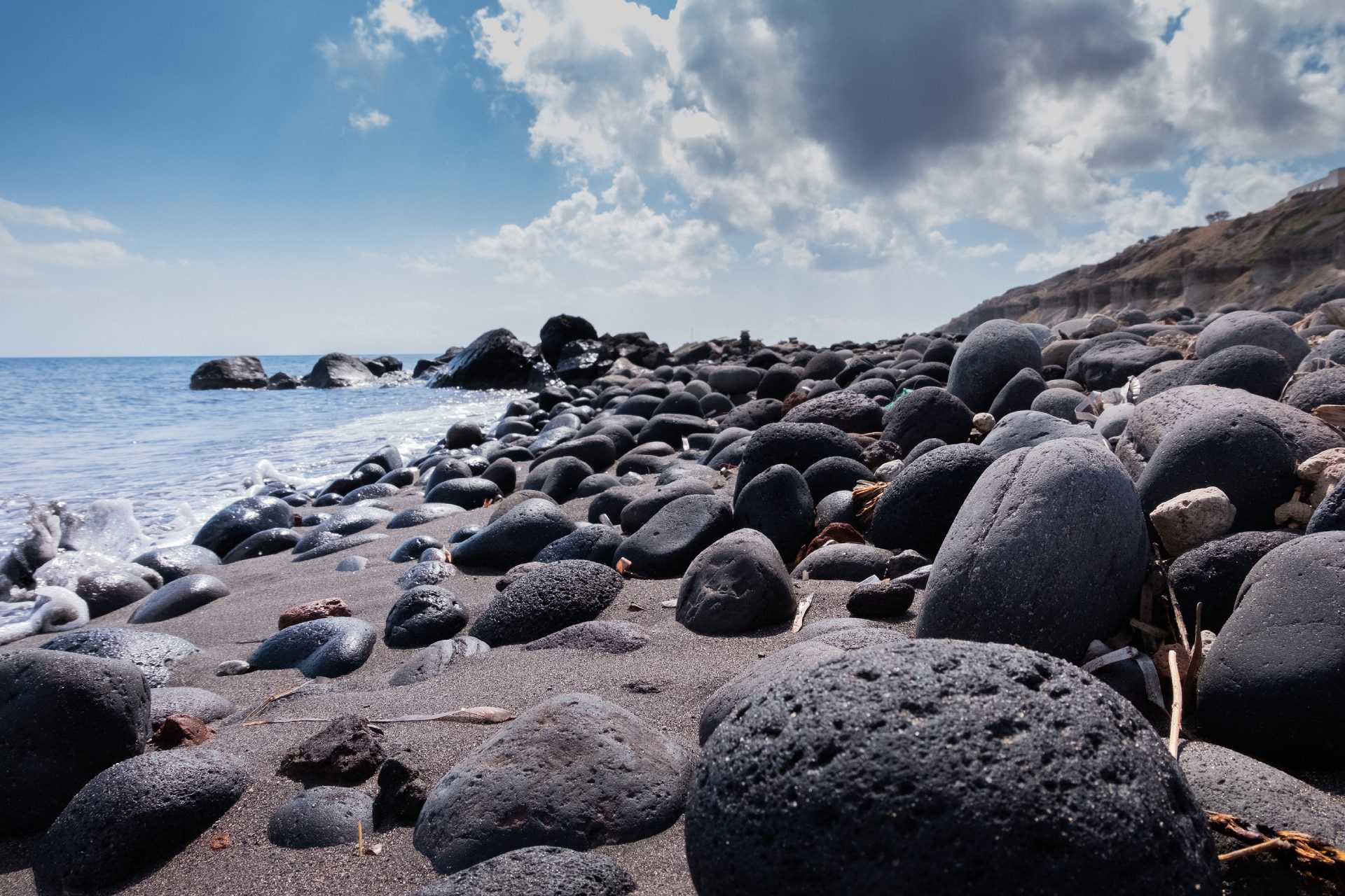 bigstock-Black-Volcanic-Stones-On-The-B-466198665